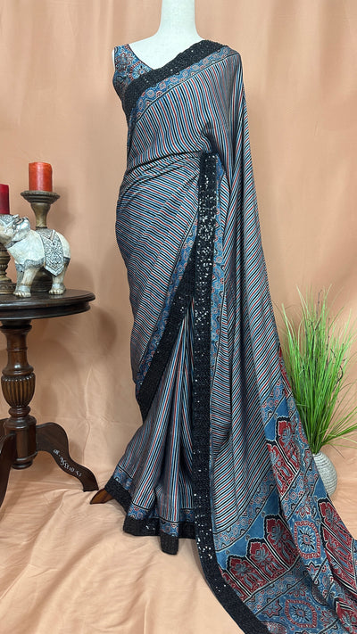 Indigo blue ajrakh modal silk saree with bead and sequins border , with stitched blouse