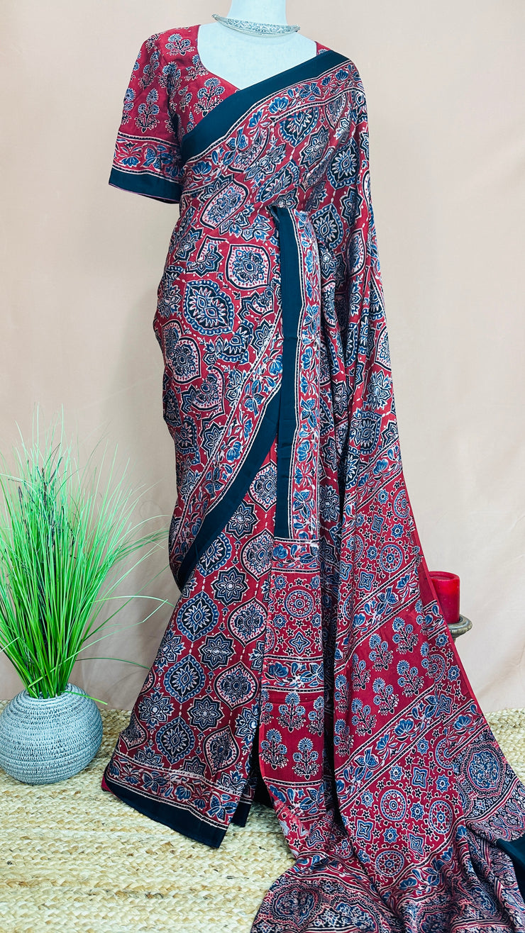 Red modal silk saree with ajrakh print on pallu and blouse, with stitched blouse