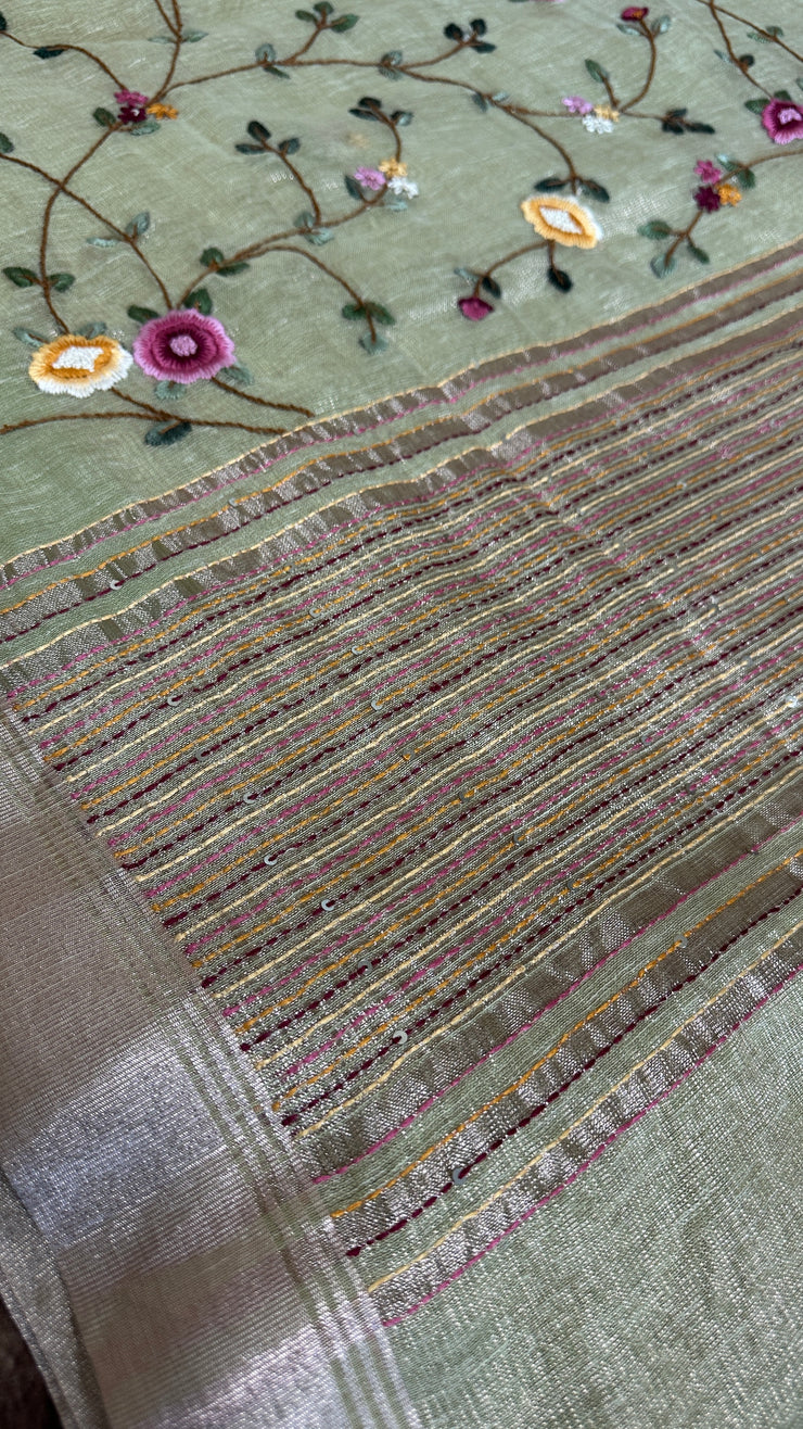 Grey tissue linen saree with hand emroidery and stitched blouse