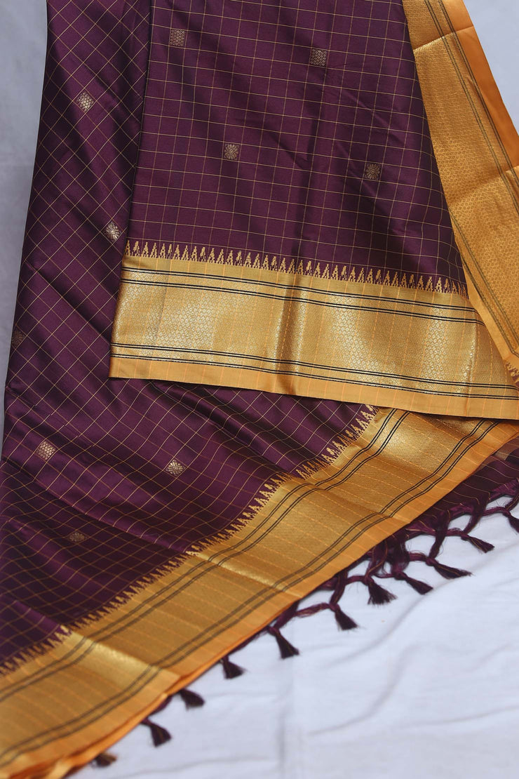 Coffe Brown semi silk saree with yellow temple border, with stitched blouse