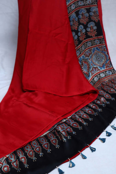 Red modal silk saree with ajrakh print on pallu and blouse, with stitched blouse