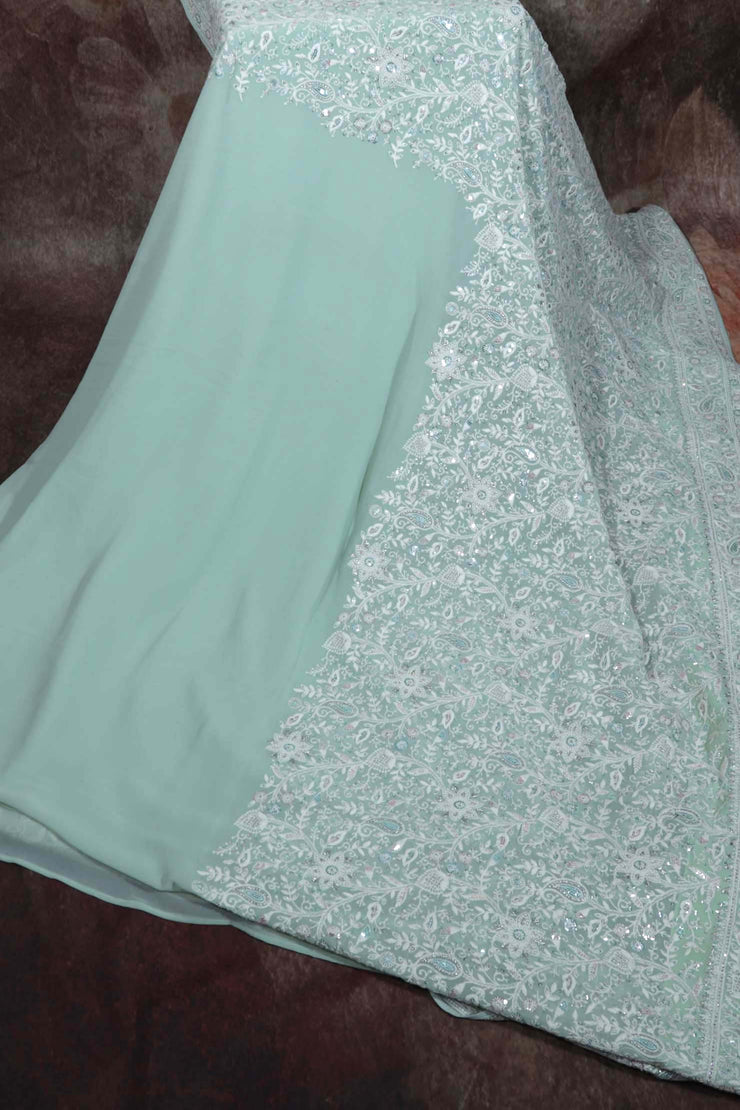 Pastel green Chikankari saree with sequins work, stitched blouse