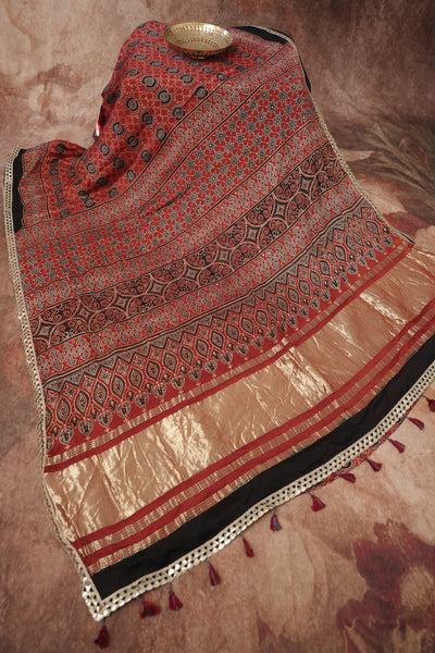 Hand block Ajrakh print Red modal silk saree with gotta patti border, with stitched blouse