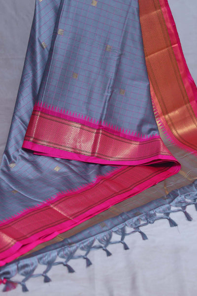 Grey semi silk saree with Pink temple border, with stitched blouse