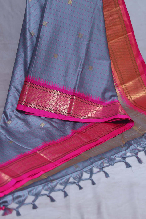 Grey semi silk saree with Pink temple border, with stitched blouse