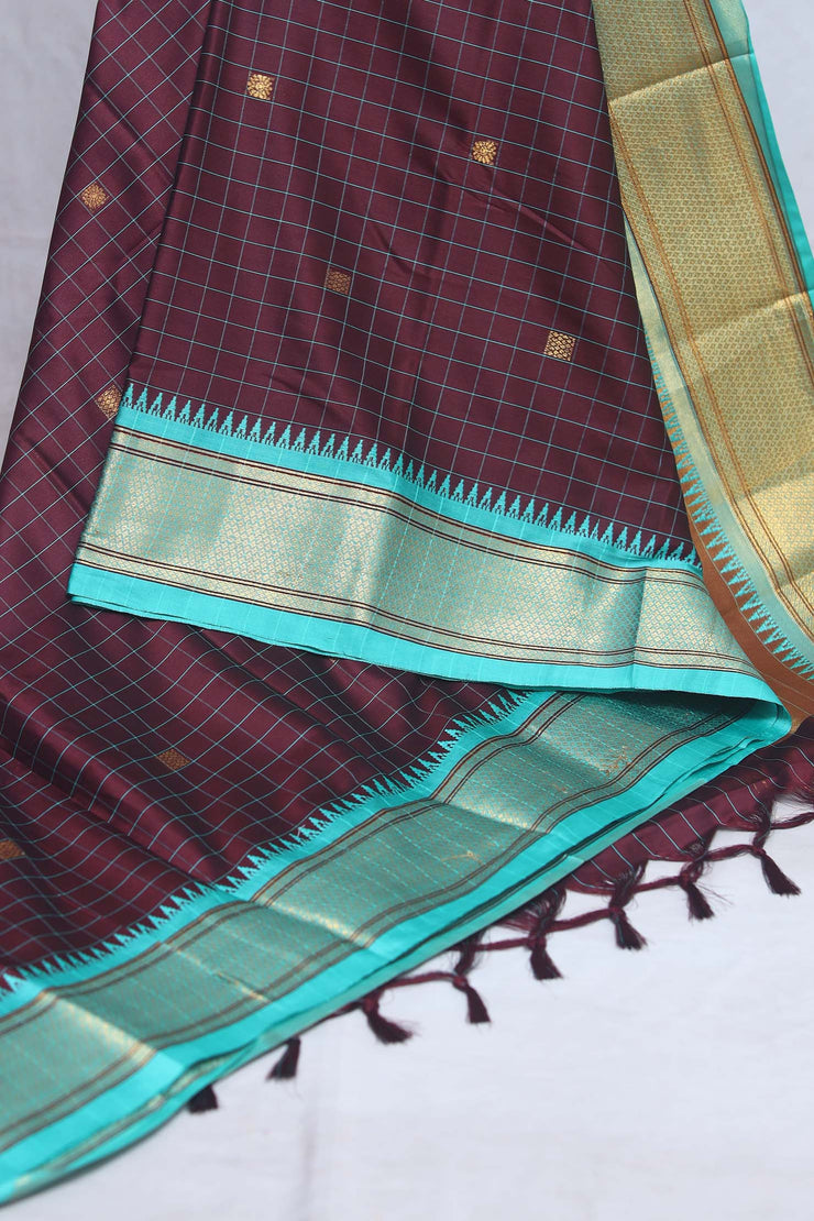 Coffe brown semi silk saree with light blue temple border, with stitched blouse