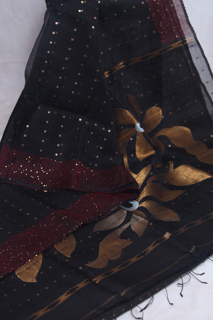 Black muslin saree with sequins weave, stitched blouse