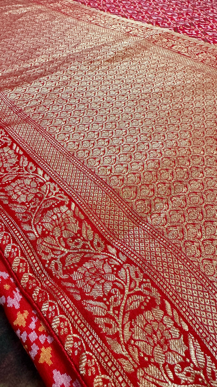 Red silk saree with pattola weave, stitched blouse