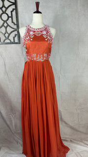 Orange crepe halterneck gown with embrodery