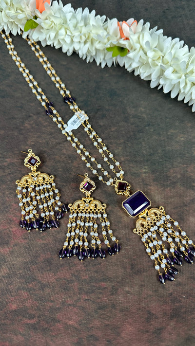 Pearl necklace with purple stone and chandlier earrings