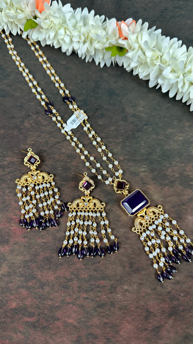 Pearl necklace with purple stone and chandlier earrings