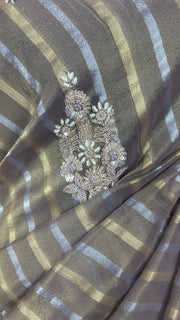 Gold and Silver striped Tissue silk saree with hand embroidery and contrast blouse