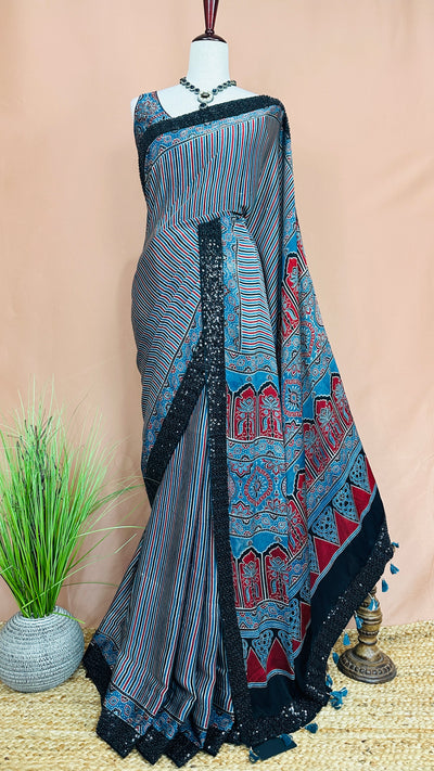 Indigo blue ajrakh modal silk saree with bead and sequins border , with stitched blouse