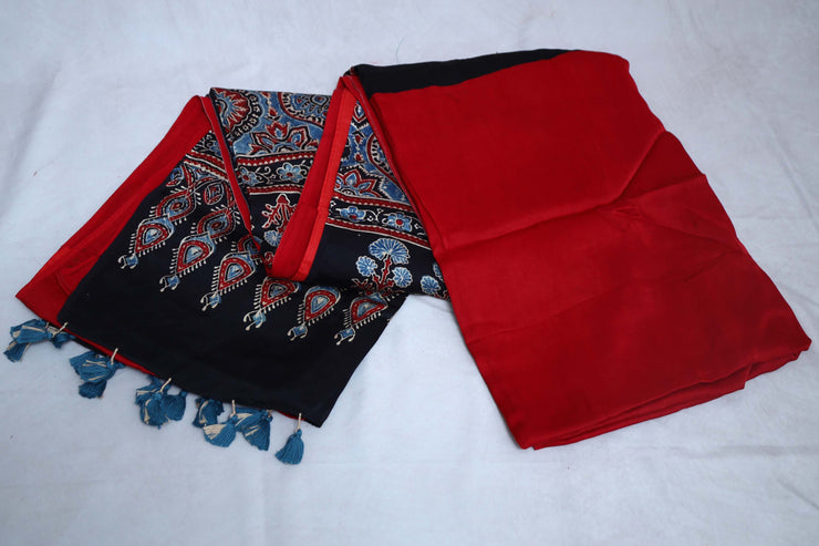 Red modal silk saree with ajrakh print on pallu and blouse, with stitched blouse