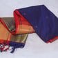 Navy blue semi silk saree with orange temple border, with stitched blouse