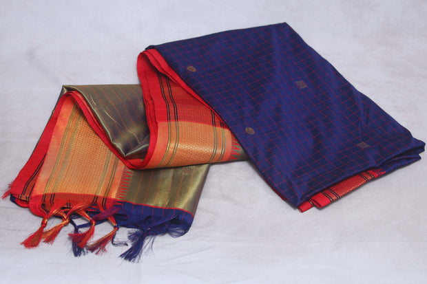 Navy blue semi silk saree with orange temple border, with stitched blouse