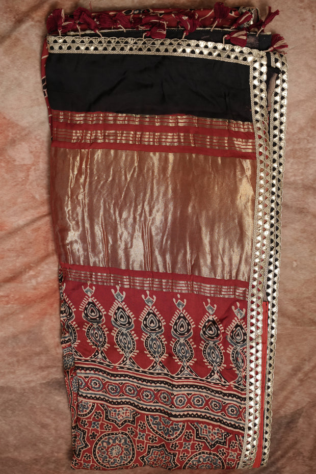 Hand block Ajrakh print Red modal silk saree with gotta patti border, with stitched blouse