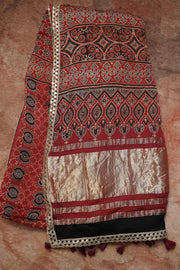 Hand block Ajrakh print Red modal silk saree with gotta patti border, with stitched blouse