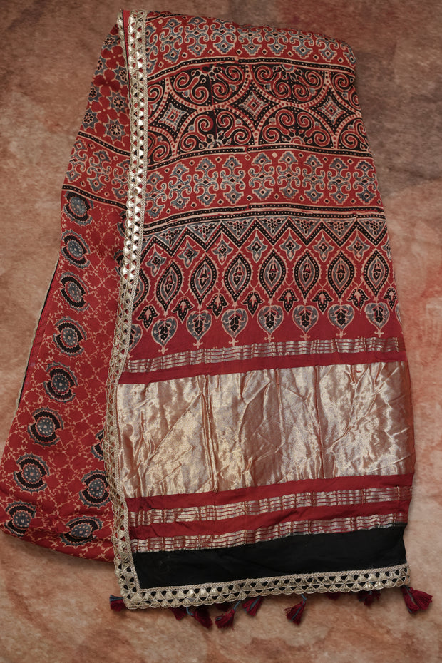 Hand block Ajrakh print Red modal silk saree with gotta patti border, with stitched blouse