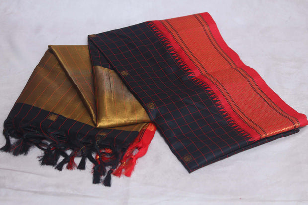 Blackn semi silk saree with orange temple border, with stitched blouse