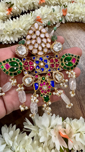 Designer pendant with kundan kemp and moizzanite stones, and chain with emrald and pearls