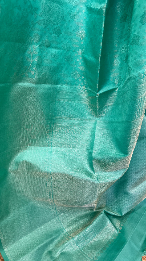 Jade green brocade saree with stitched blouse