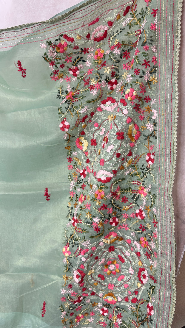 Light sea green tissue linen saree with hand emroidery and stitched blouse