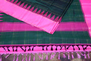 Handwoven Bottle green  Kanchivaram  pure silk saree with pink temple border and stitched blouse