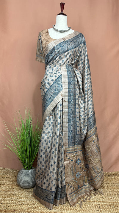 Printed Tussar silk saree with hand emroidery and stitched blouse