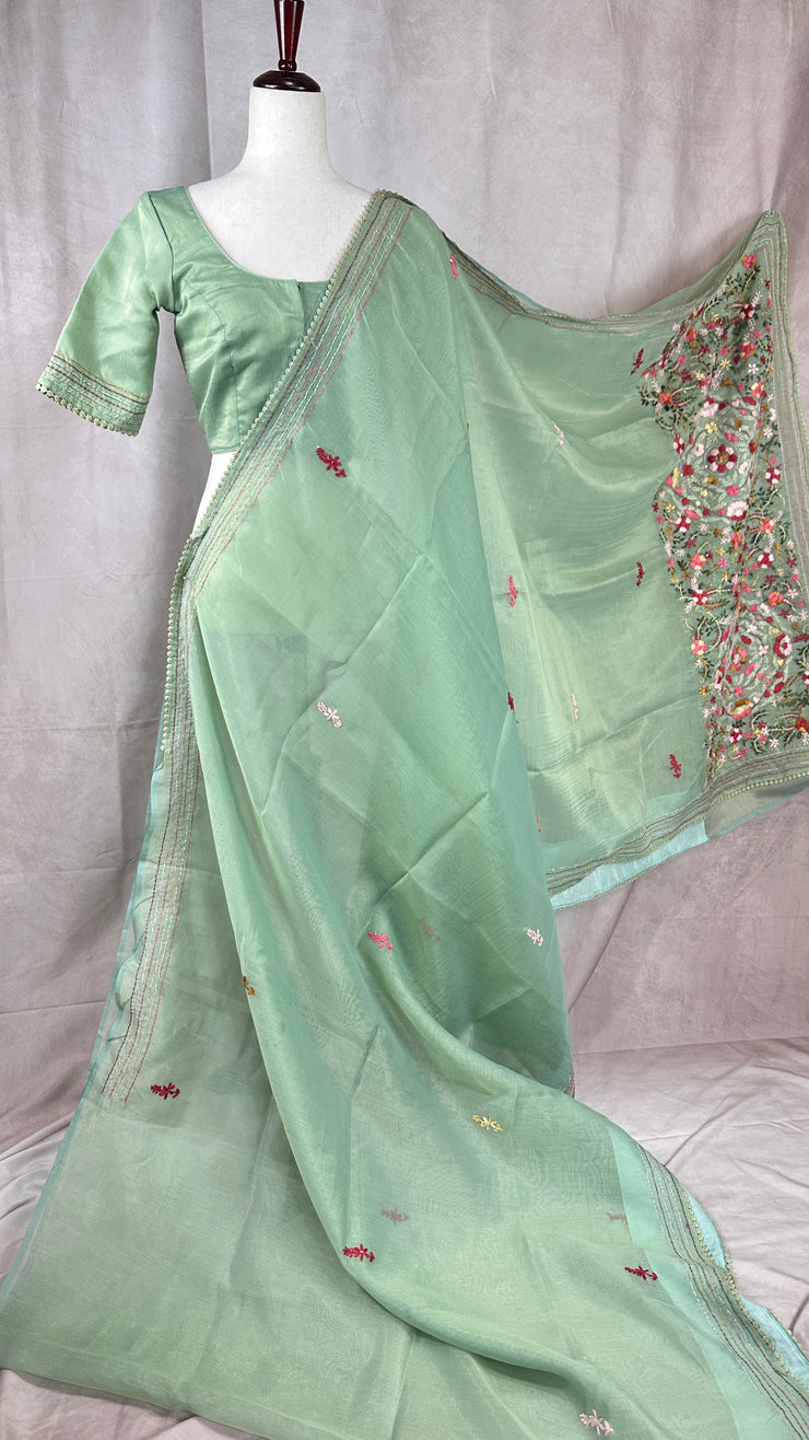 Light sea green tissue linen saree with hand emroidery and stitched blouse