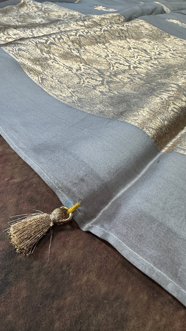 Hand woven Grey Kora Banarsi saree with silver and gold zari stitched blouse