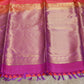 Orange 80/20 Kanchivaram saree with purple border, stitched blouse