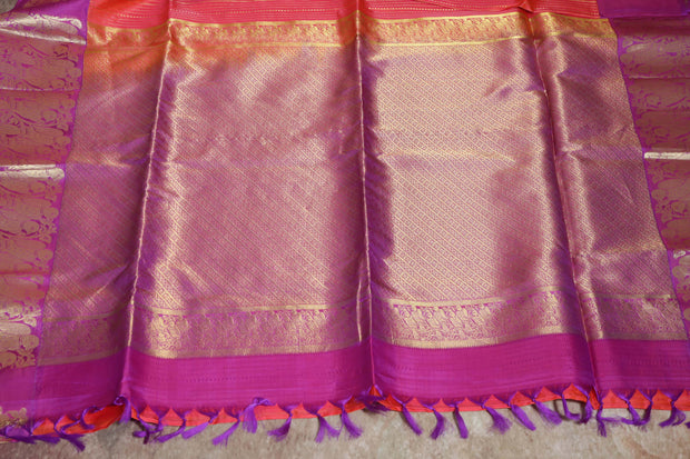 Orange 80/20 Kanchivaram saree with purple border, stitched blouse