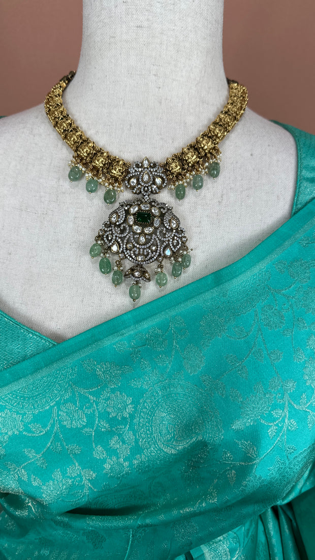 Jade green brocade saree with stitched blouse