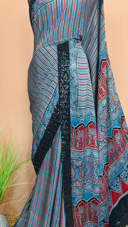 Indigo blue ajrakh modal silk saree with bead and sequins border , with stitched blouse