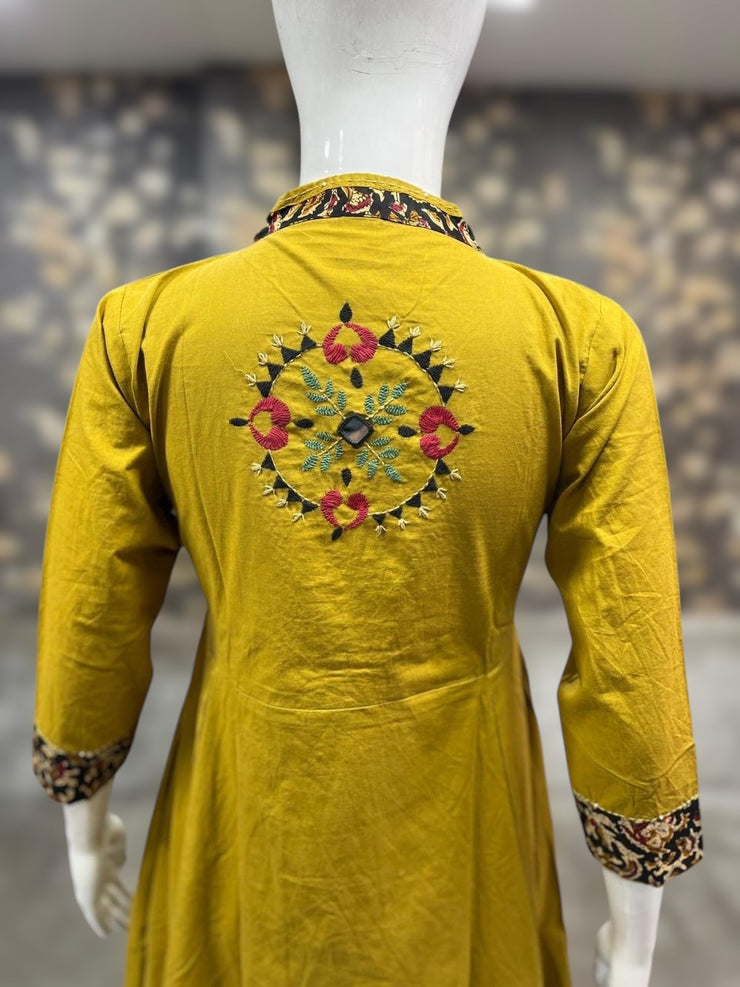 mustard yellow cotton kurti with handwork on back neck , and bottom