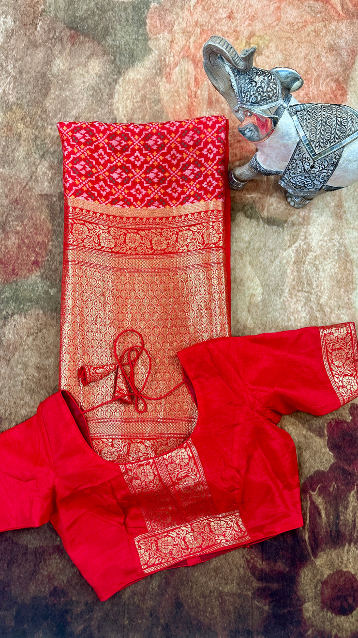 Red silk saree with pattola weave, stitched blouse