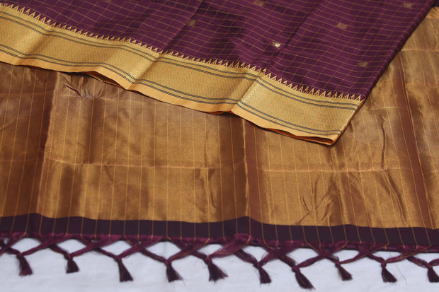 Coffe Brown semi silk saree with yellow temple border, with stitched blouse