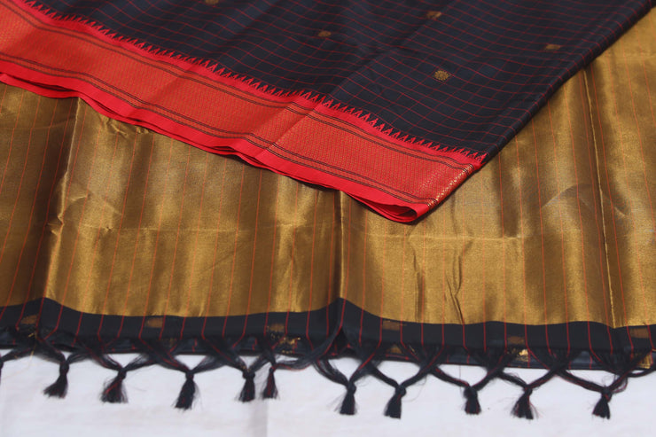 Blackn semi silk saree with orange temple border, with stitched blouse