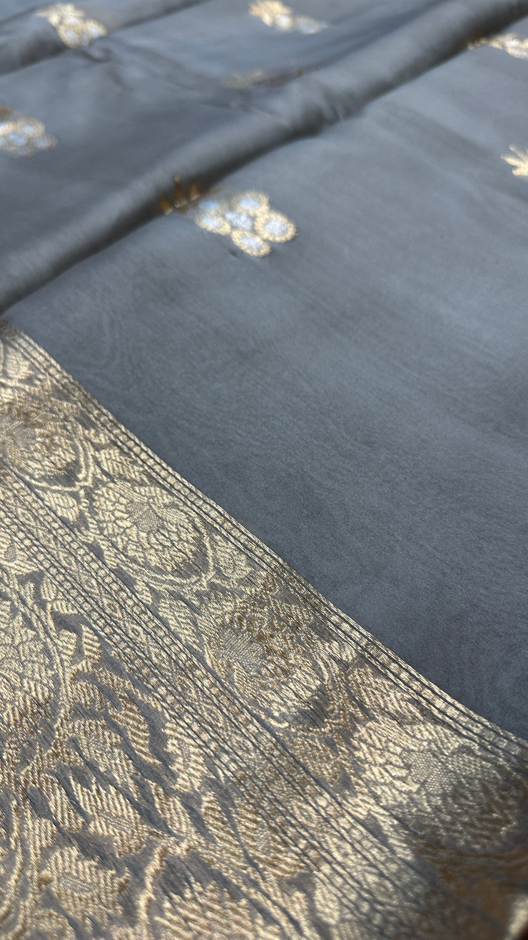 Hand woven Grey Kora Banarsi saree with silver and gold zari stitched blouse