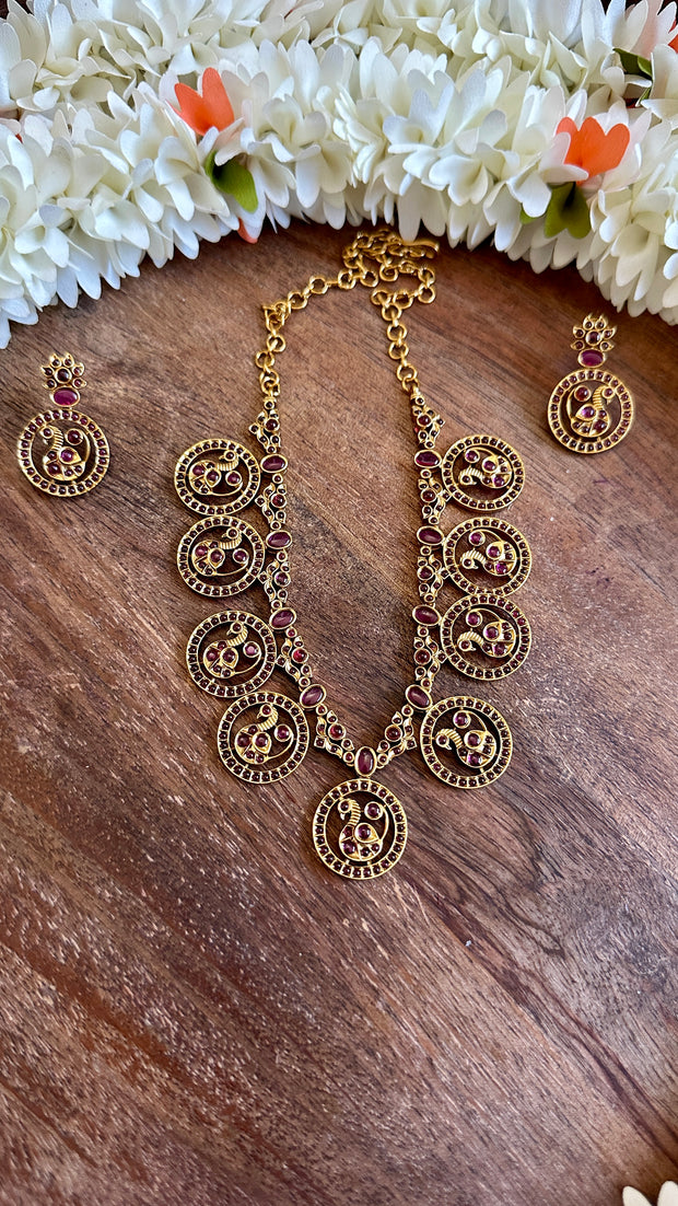 Gold necklace with ruby stones and earrings