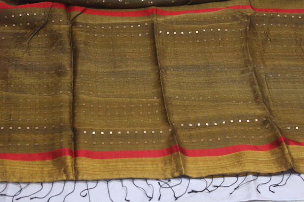 Pure muslin silk saree with weaved sequins and stitched blouse