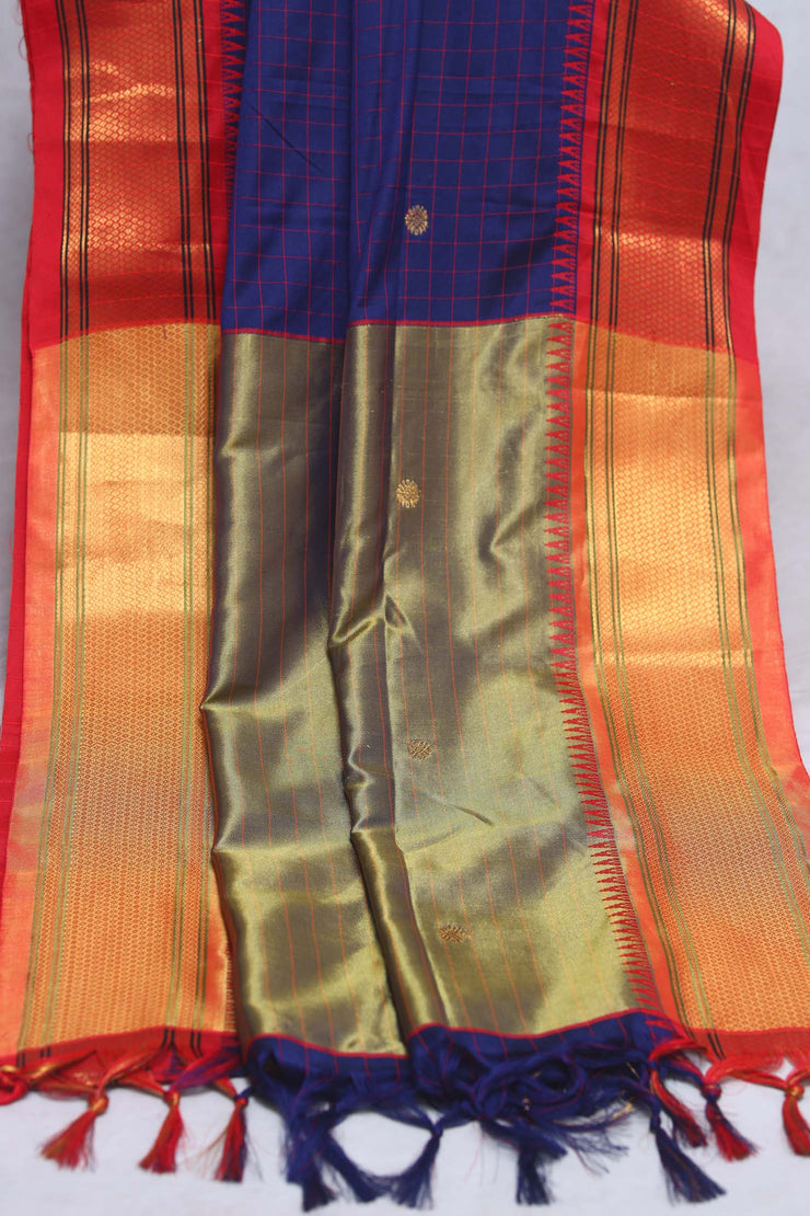 Navy blue semi silk saree with orange temple border, with stitched blouse