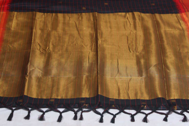 Blackn semi silk saree with orange temple border, with stitched blouse