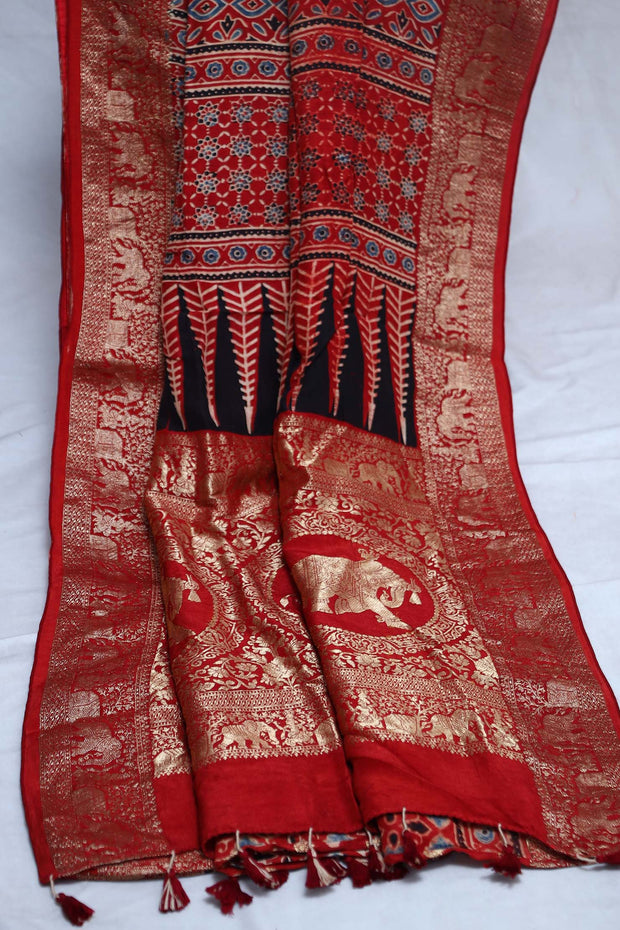 Dola silk saree with Ajrakh hand block print , stitched blouse