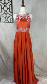 Orange crepe halterneck gown with embrodery