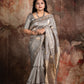 Hand woven Grey Kora Banarsi saree with silver and gold zari stitched blouse