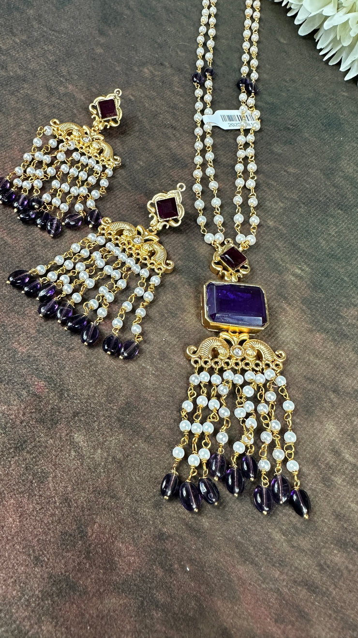 Pearl necklace with purple stone and chandlier earrings