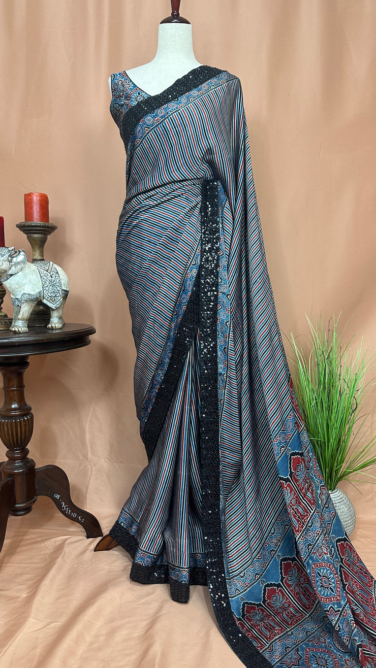 Indigo blue ajrakh modal silk saree with bead and sequins border , with stitched blouse