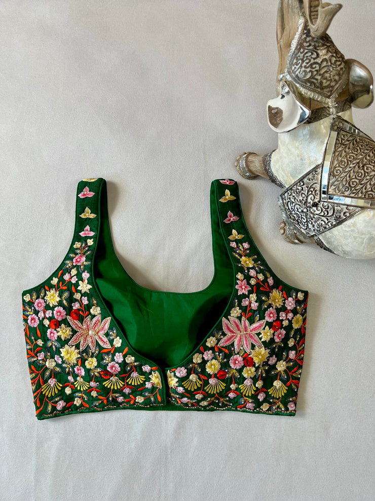 Green sleeveless blouse with stone and bead work